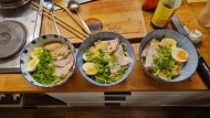 The result after many hours of work: Tonkotsu ramen with soft-boiled egg, a pinch of grated garlic and green spring onion rings.