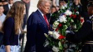 Trump takes part in the wreath-laying ceremony at Arlington Cemetery.