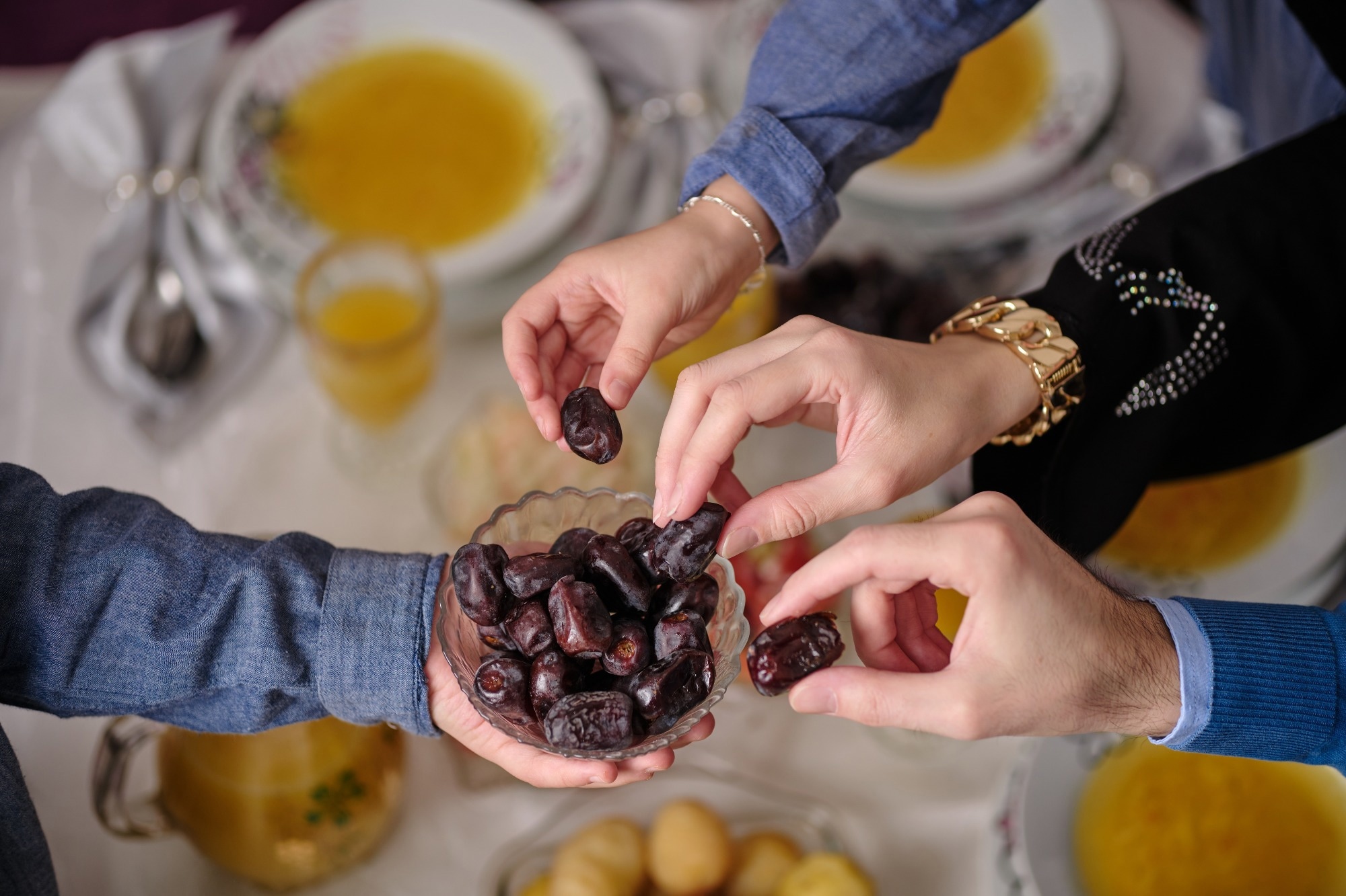 Muslim family having iftar dinner to break fasting during Ramada