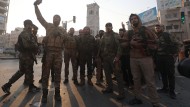 Selfies of success: Fighters take photos of themselves in the newly conquered city of Hama