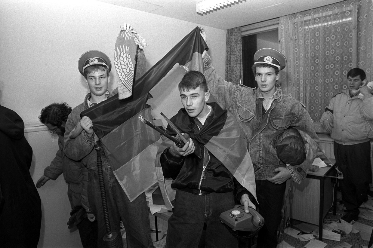 The end of the haunted: a group demonstrator in a devastated office of the Stasi headquarters on January 15, 1990