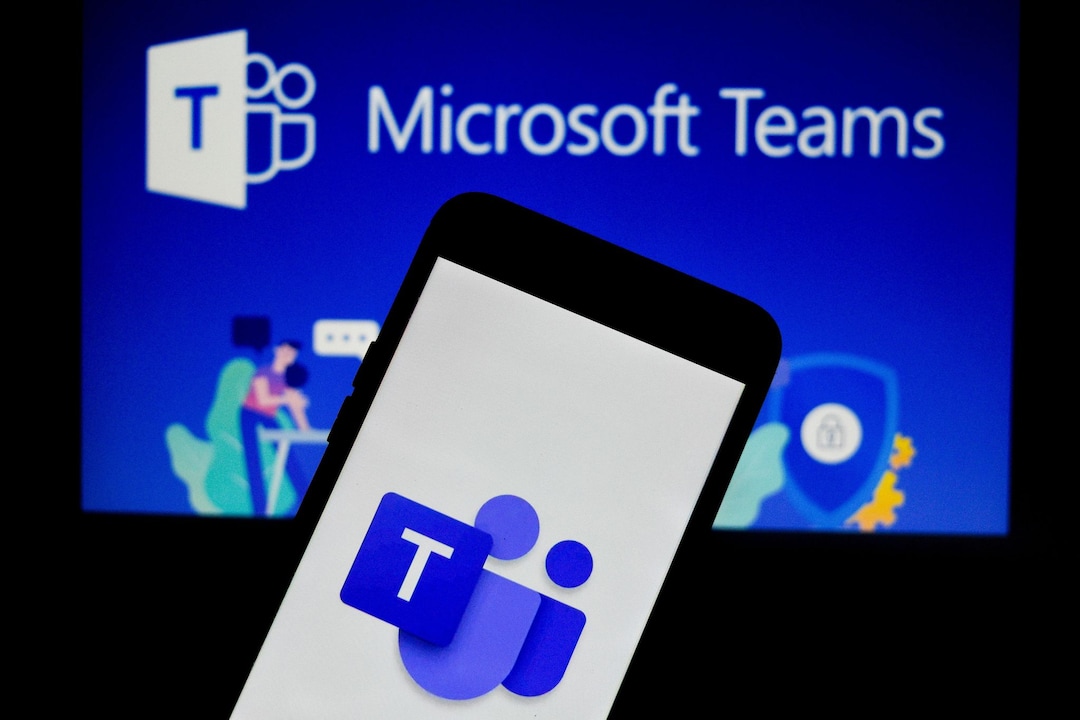 The logo of the communication application team from Microsoft can be seen on a cell phone.