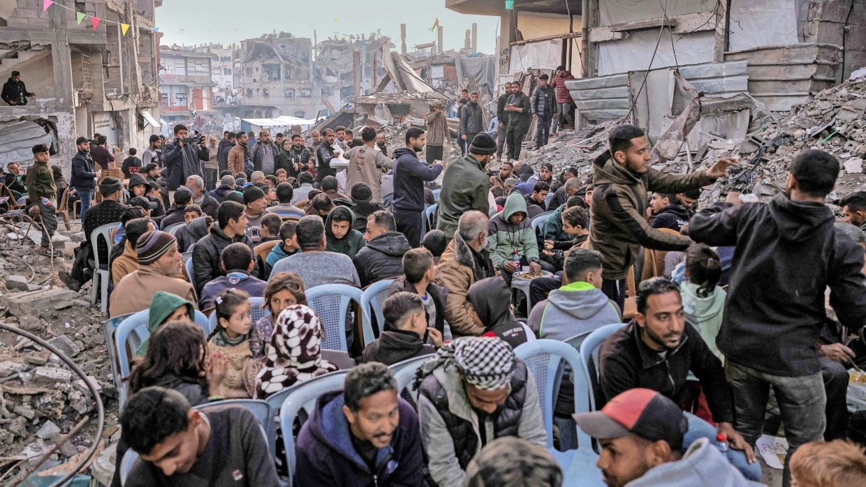 Fasting in Ramadan: People gather in Jabaliya in the north of the Gaza Strip on Saturday.