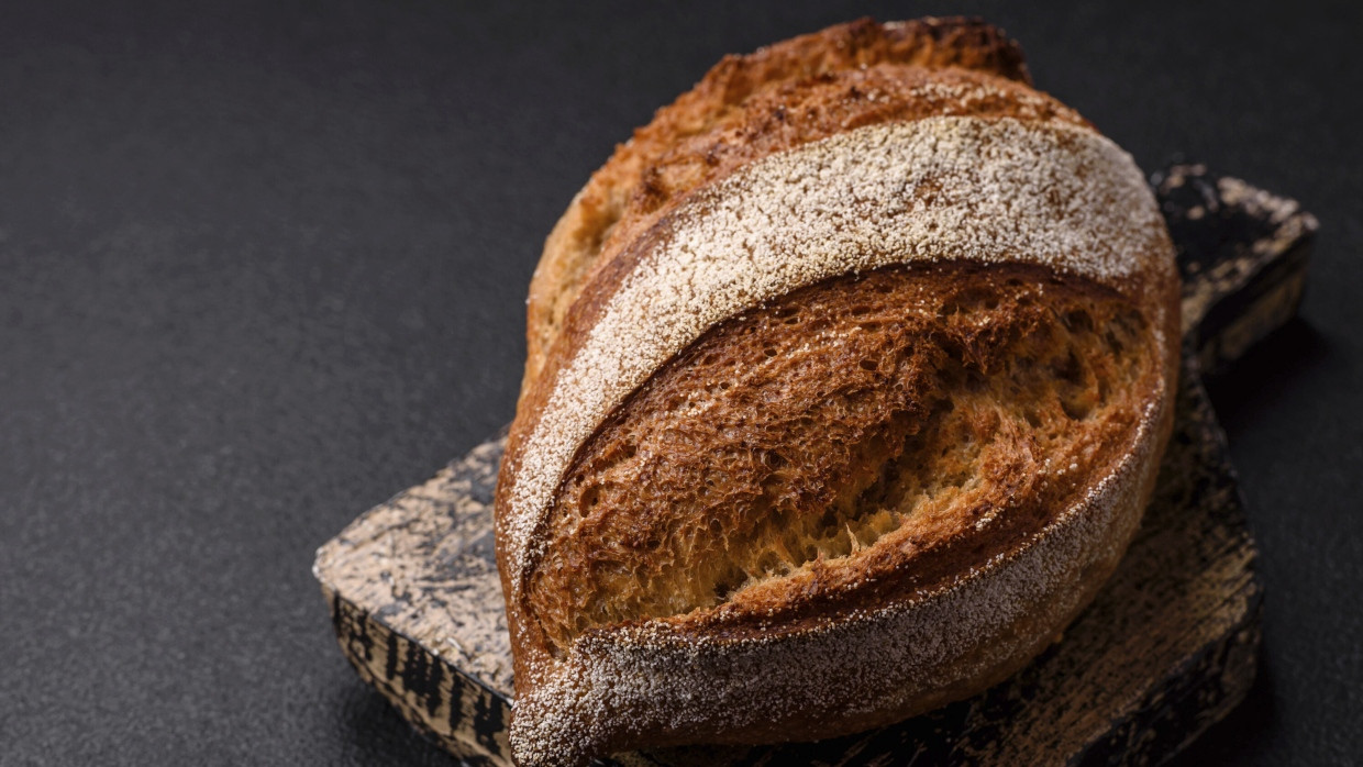 As long as the loaf has not yet set mold, it would be much too bad to just throw the bread away.