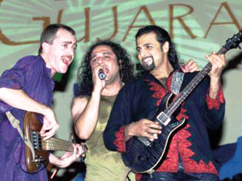 Salman Ahmad, Ali Azmat, and Brian O’Connell performing at a concert