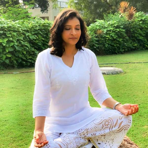 A photo of Manjula taken while practising Yoga