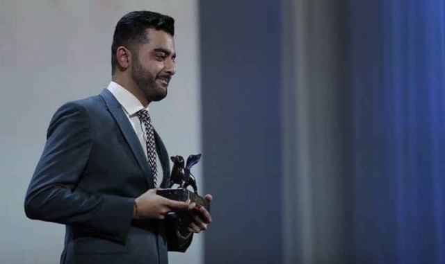 Saim Sadiq holding Orizzonti Award for Best Short Film at the 2019 Venice Film Festival