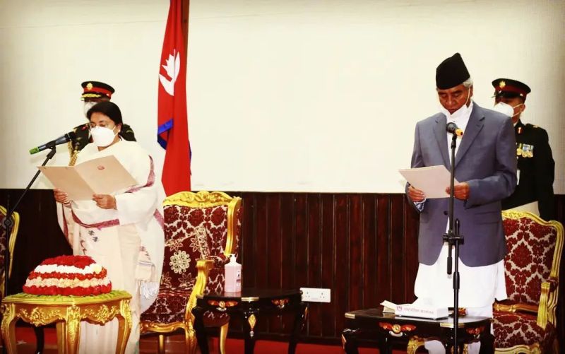 Sher Bahadur Deuba (right) taking oath as Prime Minister of Nepal for the fifth time