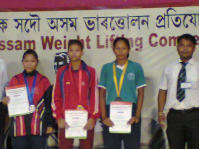 Popy Hazarika after winning gold in district meet in 2014 (in red and blue)