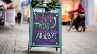 A sign in downtown Oldenburg points to “Black Friday” offers.