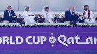 Playmaker: FIFA boss Infantino (2nd from right) and IOC President Bach (left) honor Qatar's Emir Hamad bin Khalifa Al Thani (middle).