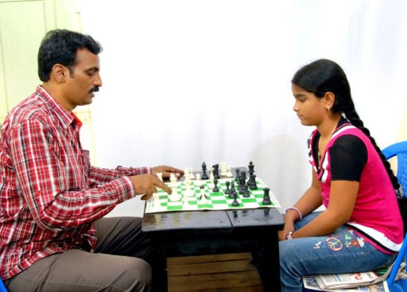 Priyanka Nutakki (right) training with her coach V. R. Bobba during her childhood