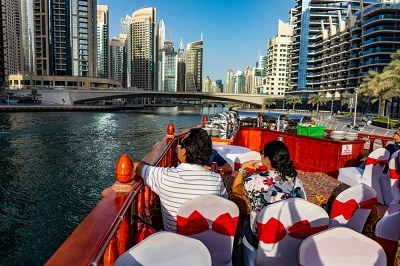 Couple Cruising around Dubai and having dinner