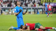 Morocco goalkeeper Yassine Bounou with Achraf Hakimi after defeating Portugal