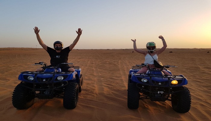 Couple enjoying Desert safari in Dubai during their honeymoon