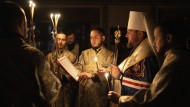 A priest holds a mass at an Orthodox church in Kyiv.