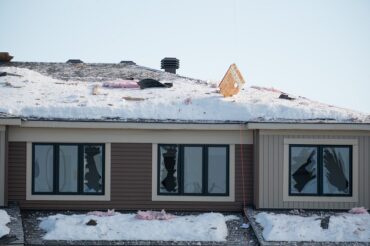 Damage seen to a nearby house following a gas explosion in Ottawa on Feb. 13, 2023.