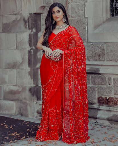 Indian women wearing Red Chiffon Saree 