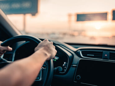 Man driving a car on the highway