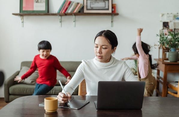 Can you legally run a business from home - woman working at home at desk